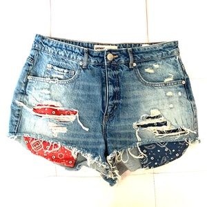 blue distressed denim shorts with pattern pockets